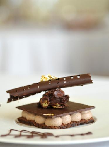 two pieces of chocolate on top of a plate at Le Médina Essaouira Thalassa Sea & Spa - MGallery Collection in Essaouira