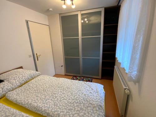 a bedroom with a bed and a closet at Ferienwohnung Holiday in Radstadt