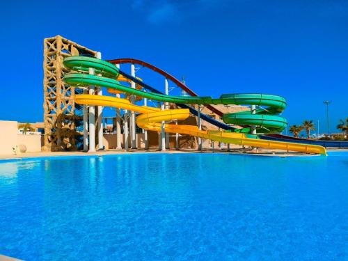a water slide in a swimming pool at Eastern El-Galala Aquapark Ain Sokhna in Ain Sokhna