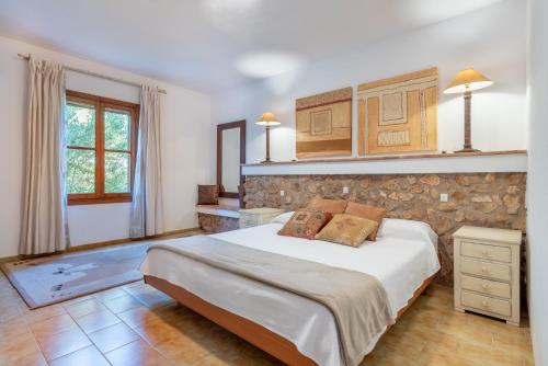 A bed or beds in a room at Finca Sa Real by Mallorca House Rent