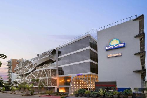 a rendering of the front of a hotel at Days Inn & Suites by Wyndham Bengaluru Whitefield in Bengaluru