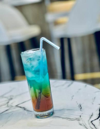 a colorful drink in a glass on a table at Base Ethiopia International Hotel in Addis Ababa
