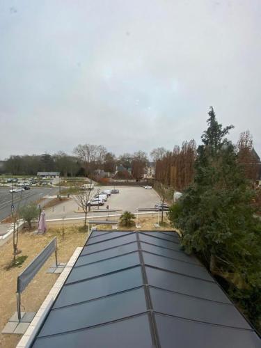 a group of solar panels on the roof of a parking lot at Chez Benjamin - Face au château d'Azay-le-Rideau in Azay-le-Rideau