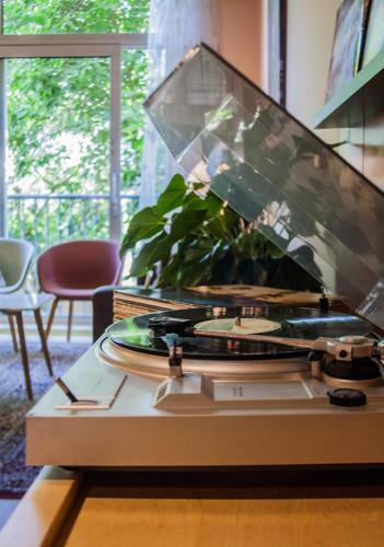 a machine sitting on a table in a room at Hotel The Neighbour's Magnolia in Amsterdam