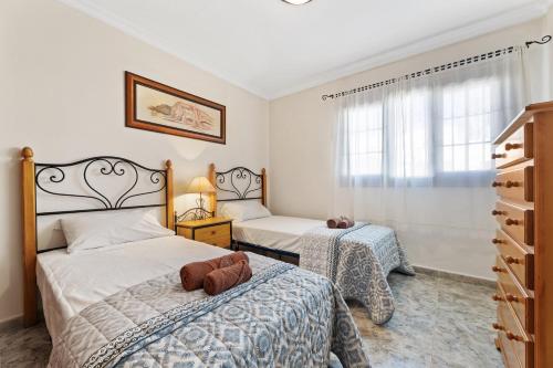 A bed or beds in a room at Blue Sky apartment