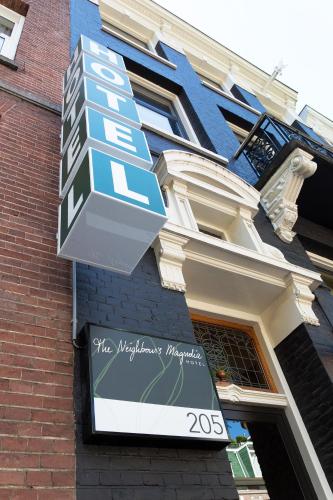 a sign on the side of a building at Hotel The Neighbour's Magnolia in Amsterdam
