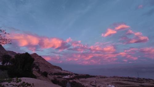 a group of clouds in the sky at sunset at Badolina Ein Gedi Glamping in Ein Gedi