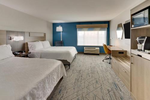 a hotel room with two beds and a television at Holiday Inn Express & Suites - Ardmore by IHG in Ardmore