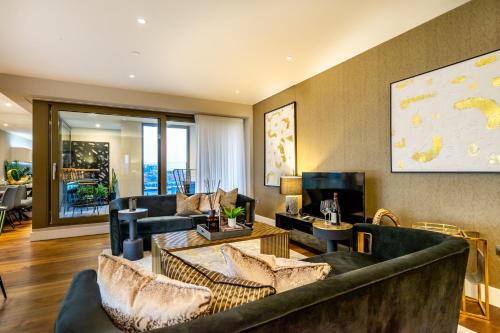 a living room with couches and a tv at The Residence @ Ryedale House in York