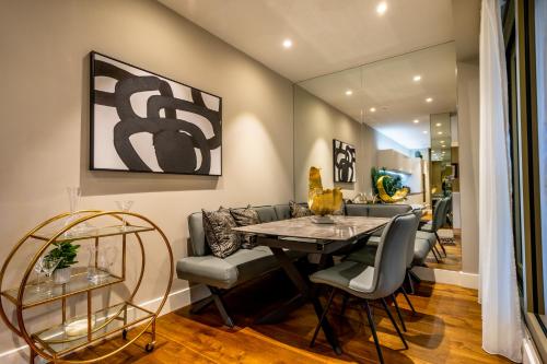 a dining room with a table and chairs at The Residence @ Ryedale House in York