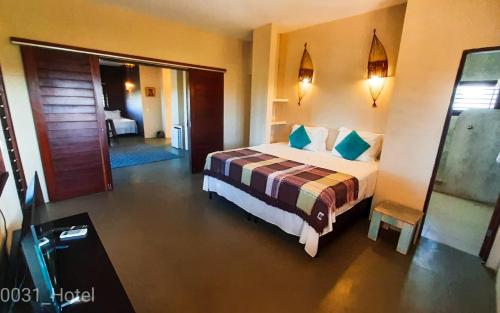 En eller flere senge i et værelse på 0031 Boutique Hotel & Restaurant Cumbuco