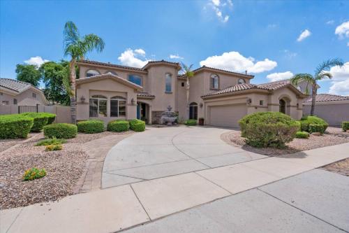 a large house with a driveway at Grand Ironhorse in Queen Creek