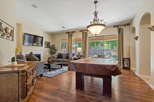a living room with a couch and a table at Grand Ironhorse in Queen Creek
