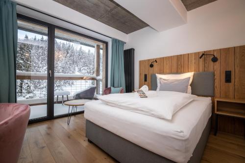 Postel nebo postele na pokoji v ubytování Erlebachova Bouda, hotel - Resort Svatý František