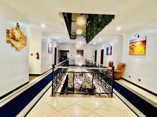 a room with a hallway with paintings on the walls at Base Ethiopia International Hotel in Addis Ababa