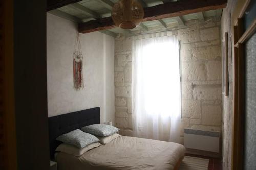 En eller flere senge i et værelse på "L'artistique" Centre Arles Fondation Van Gogh