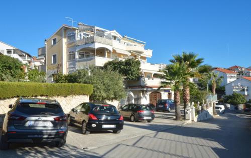 a group of cars parked in front of a building at Villa Klaudia in Trogir