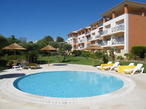 Luxurious first floor apartment with balconies overlooking pool and gardens.