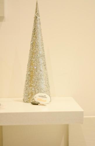a silver christmas tree sitting on top of a table at Nnakkara Guest House in Santo Stefano di Camastra