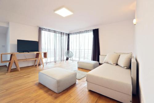 Μια τηλεόραση ή/και κέντρο ψυχαγωγίας στο Living In Aparthotel