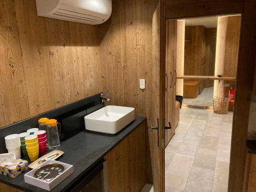 a kitchen with a sink and a counter top at JOHAN HOTEL in Zlín