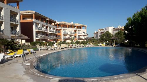 Luxurious first floor apartment with balconies overlooking pool and gardens.
