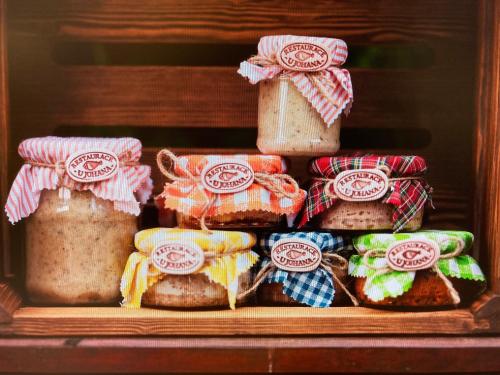 a shelf with different types of food in jars at JOHAN HOTEL in Zlín