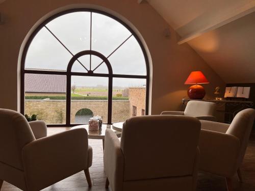 Posezení v ubytování Hotel Het Heilig Genot