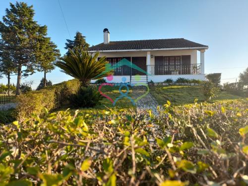 a house with a garden in front of it at Mary's House in Cantanhede