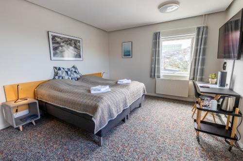 Ένα ή περισσότερα κρεβάτια σε δωμάτιο στο HOTEL SØMA Nuuk