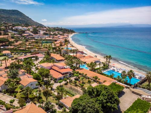 an aerial view of a resort and the beach at Villaggio Baia D'Ercole in Capo Vaticano