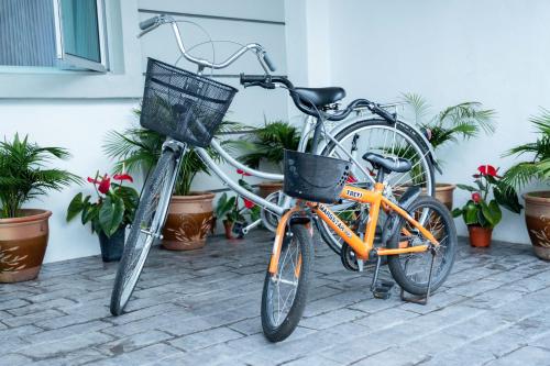 two bikes parked next to each other in front of a building at Comfy Sofy 21- Backyard Garden- Night Market area in Cameron Highlands