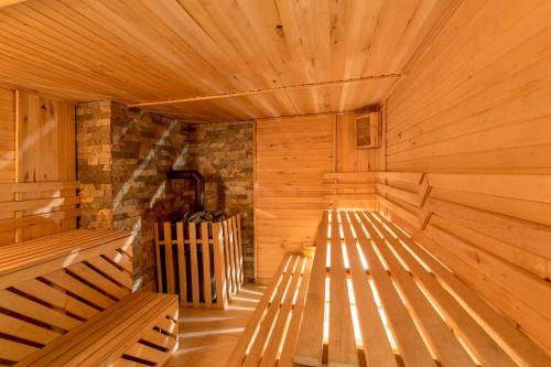 an empty wooden sauna with two benches in it at Karpatski Dzherela in Yaremche
