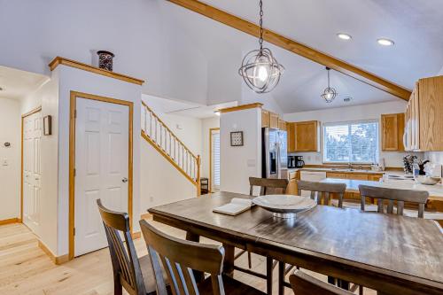 a kitchen and dining room with a table and chairs at Golden Pheasant Retreat in Redmond