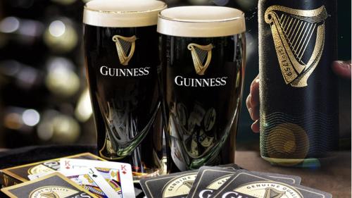 two glasses of beer sitting on top of a table at Toddys Cottage & Stables in Cavan