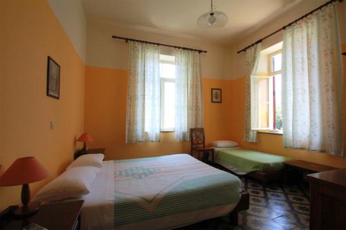 Ένα ή περισσότερα κρεβάτια σε δωμάτιο στο Ξενοδοχείο Αναστασία
