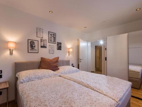 a bedroom with a large bed in a room at Seereith Apartments in Brixen im Thale