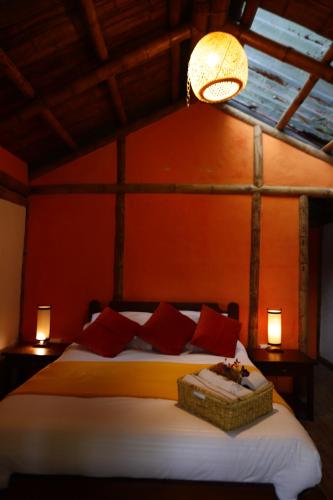 Postel nebo postele na pokoji v ubytování Ecohotel Monteverde