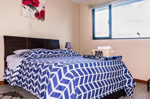 Cama o camas de una habitación en Vineyard Apartments & Suits