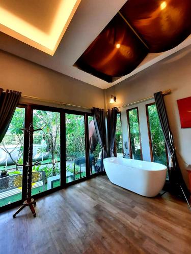 Ένα ή περισσότερα κρεβάτια σε δωμάτιο στο Amantra homestay & village