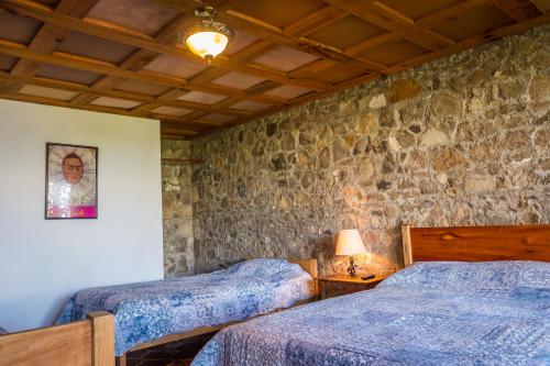 Ένα ή περισσότερα κρεβάτια σε δωμάτιο στο Hotel Terrazas Del Lago