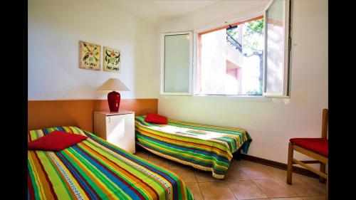 Voodi või voodid majutusasutuse Marina Corsa Residence Three rooms apartment 150 m from the beach - Ghisonaccia toas