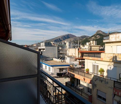 a view of a city from a balcony at Zen Luxury Apartments in Xanthi