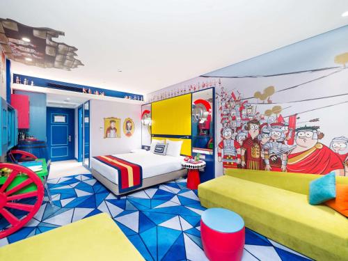 a childrens bedroom with a bed and a mural at The Land Of Legends Kingdom Hotel in Belek