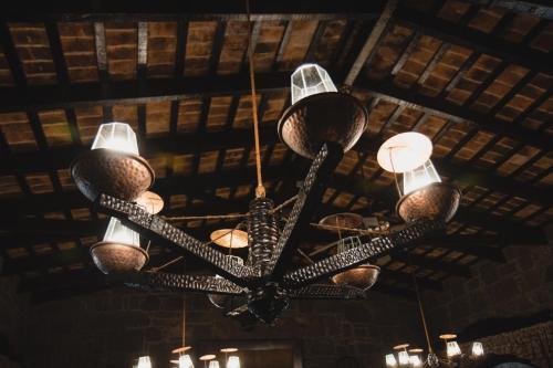 a chandelier hanging from the ceiling of a building at Hosteria Fortin de San Miguel in Chuy
