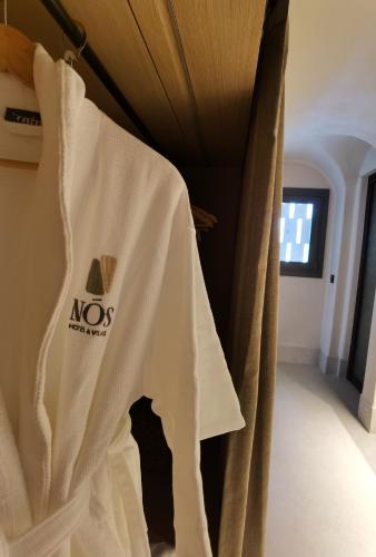 a white curtain is hanging in a room at NOS Hotel & Villas in Sifnos