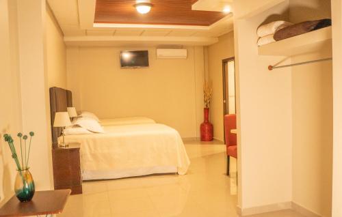 Un ou plusieurs lits dans un hébergement de l'établissement Orquidea Limon Hotel Boutique