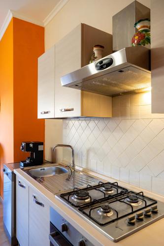 a kitchen with a stove and a sink at Urban Suite in Cassino
