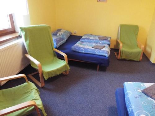 Una cama o camas en una habitación de Fähnrichův mlýn