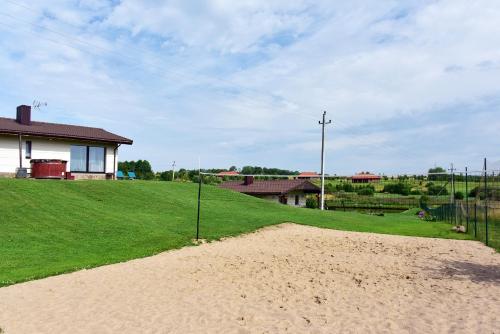 a dirt road in front of a house at Vila Trakai in Trakai